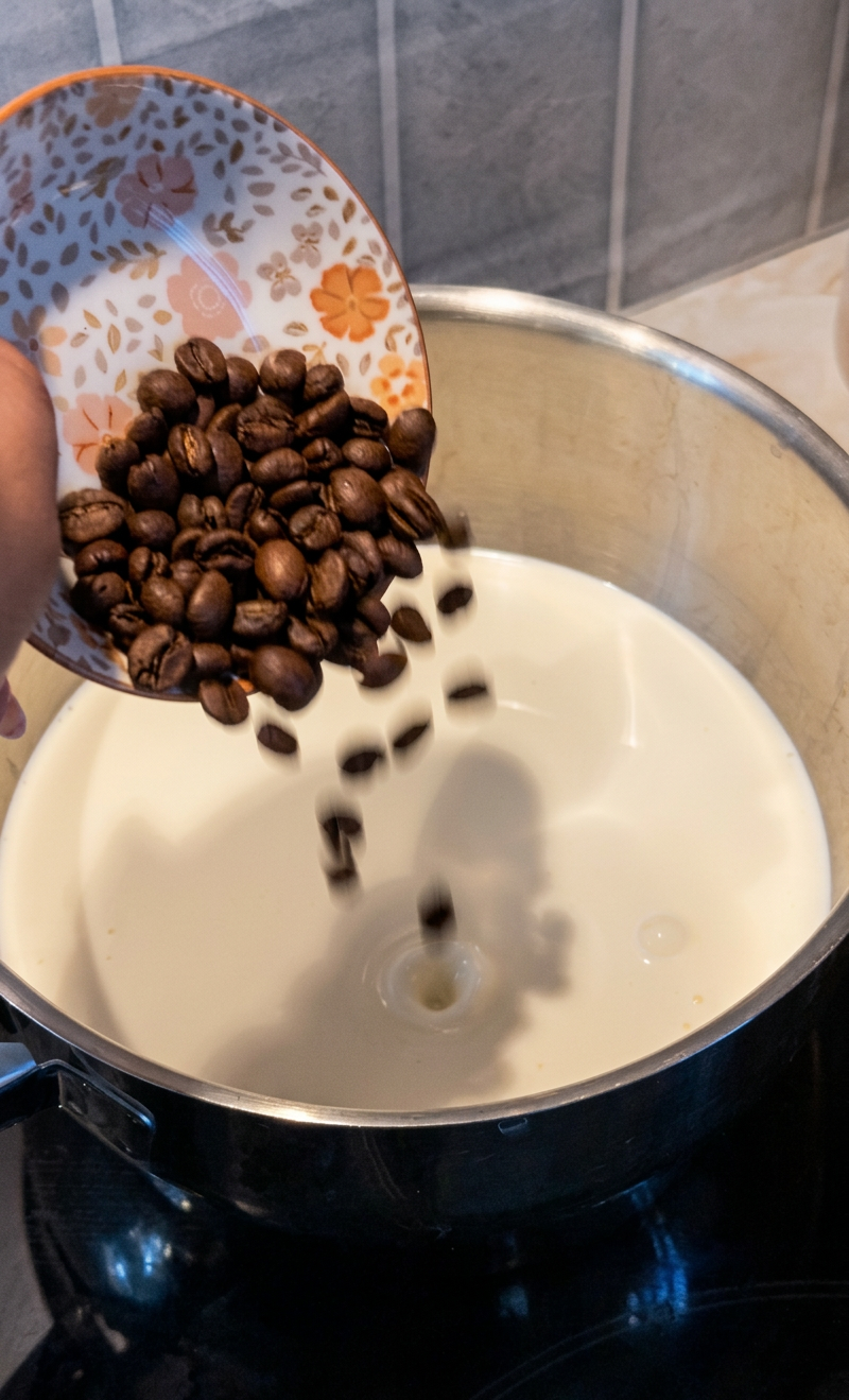 Adding whole coffee beans to the cream mixture